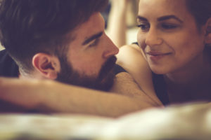 Couple looking at each other with vulnerability