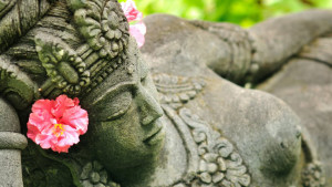 Feminine essence pleasure tips - Female stone statue with flower