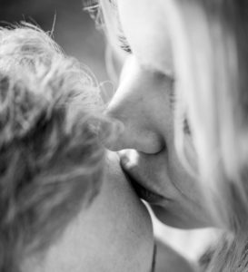 Woman kisses man on forehead. Blog Two mistakes in relationships