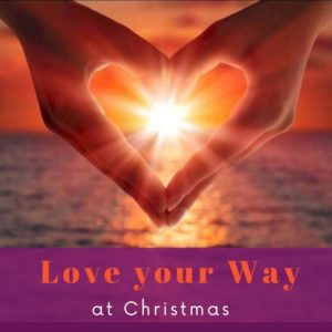 hand a make a heart shape with sun shining between. Love your way at Christmas