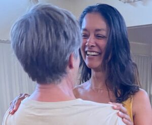 Couple - women smiling at man. she wants to be met